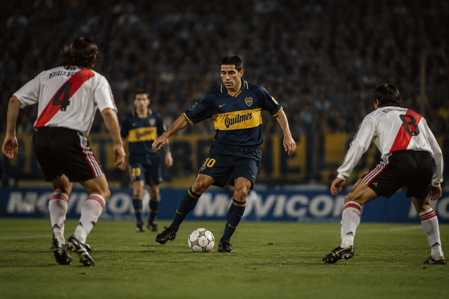 An enganche in football controlling possession between defenders during a professional match under stadium floodlights.